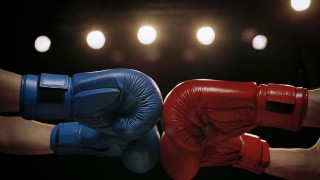 Close Up of Boxers Touching Boxing Gloves Before Fight